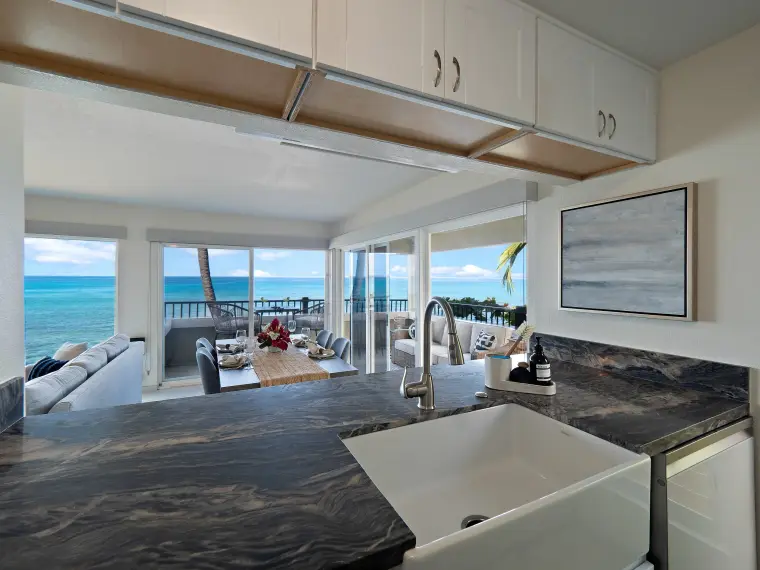 Kitchen counter looking through to dining area, lanai, and ocean